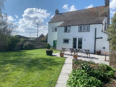 A house with a lawn garden patio and outdoor furniture at Ley Mill Farm in Huntley