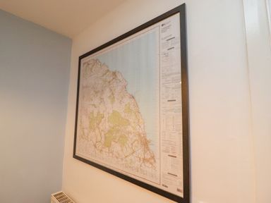 A map framed on a wall above a radiator at Pond Farm View in Hinderwell