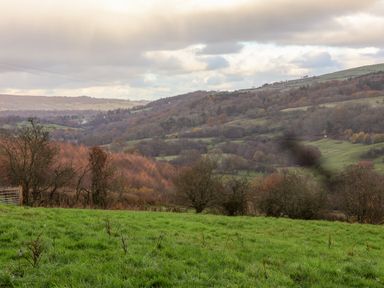 A countryside landscape with rolling hills trees and grassy fields at Foxglove in Goathland