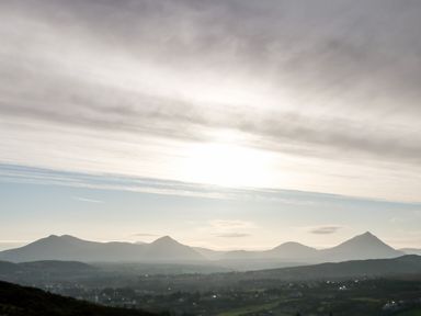 A landscape with mountains and a cloudy sky at The Beachhouse in Meenlaragh near Gortahork County Donegal