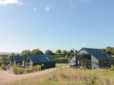 A view of modern houses in a field at Foxes Den in Allerston near Thornton Dale