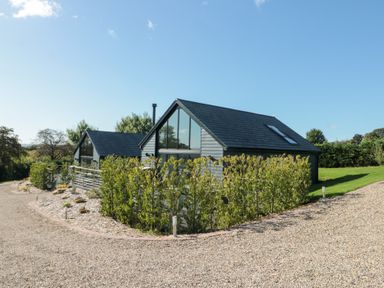 A house with a garden and gravel path at Foxes Den in Allerston near Thornton Dale