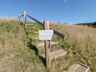 A sign indicating a dog exercise field at Eagles Peak in Allerton near Thornton-Le-Dale