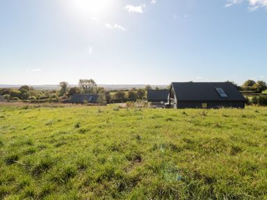 A view of houses and grass in the landscape at Eagles Peak, Allerton near Thornton-Le-Dale