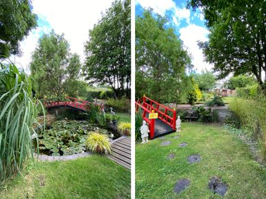 A garden with a red wooden bridge over a pond with lily pads and green trees at Cherry Pod in Hookagate near Meole Brace
