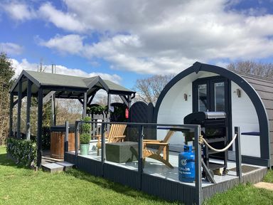 An outdoor area with furniture and barbecue at Cherry Pod Hookagate near Meole Brace