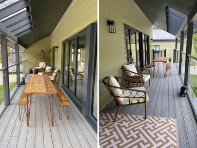 A covered balcony with a wooden table bench set wicker chairs with cushions a hanging chair and a glass railing at Primrose Hellandbridge near Bodmin