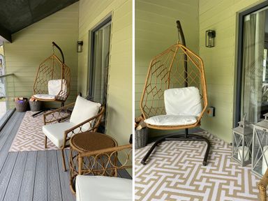A balcony with a hanging chair white cushions woven furniture and patterned rug at Primrose in Hellandbridge near Bodmin