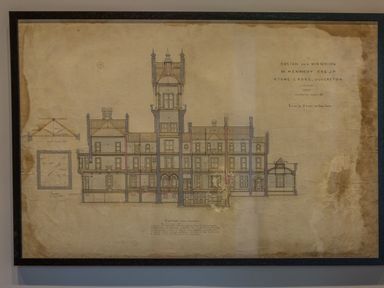 An architectural drawing of a mansion design framed and hung on a wall at William Tower Suite Stone Cross Mansion Ulverston