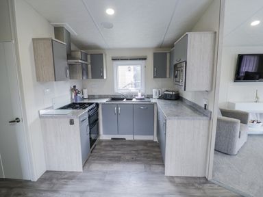 A kitchen with cabinets and appliances at Serendipity