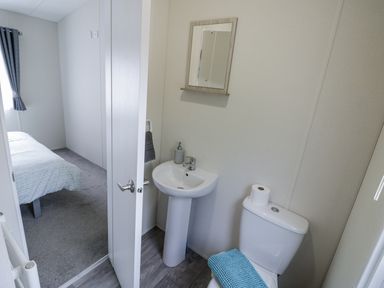 A bathroom with sink and toilet at Serendipity
