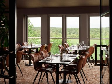 A dining room with tables and chairs at Cosy Corner in the Lakes Greystoke