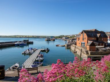 A marina with boats and a building at Trelowen in St Issey near Padstow