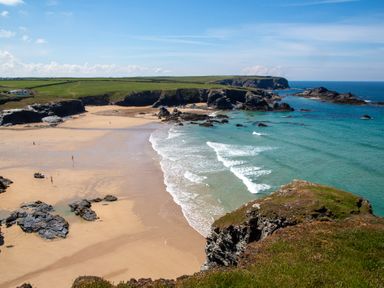 A beach with waves and rocks at Trelowen in St Issey near Padstow
