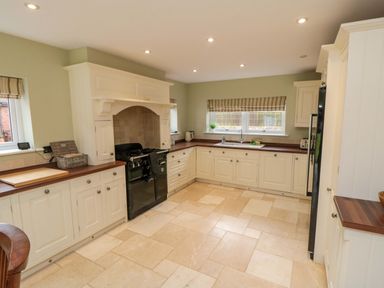 A kitchen with cabinets and a cooking range at Wyvill House in Cayton
