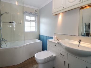 A bathroom with bathtub and shower at Seaward in Trimingham