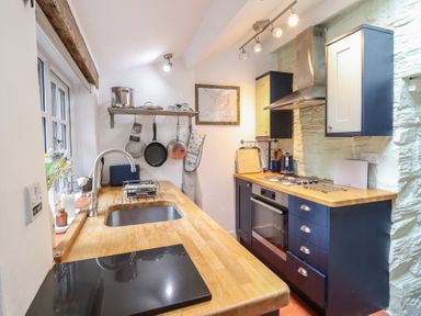 A kitchen with a sink and countertop at Preswylfa in Ffestiniog