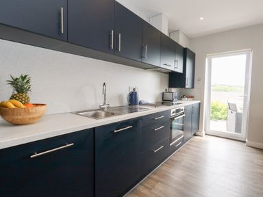 A kitchen with cabinets and appliances at Durbyfield in Nottington near Weymouth