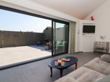 A living room with a view of the terrace at Ninky Nonk in Bristol