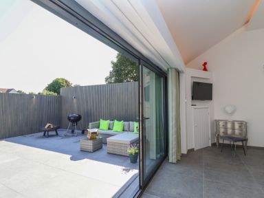 An outdoor space with seating and a grill at Ninky Nonk in Bristol