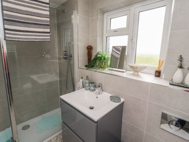 A bathroom with a shower and sink at Country Retreat in Ponteland