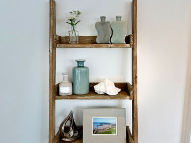 A shelf with vases and a photo frame at 11 The Gables Lyme Regis