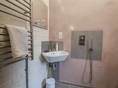 A bathroom with a sink and shower at The Dairy in Bridport