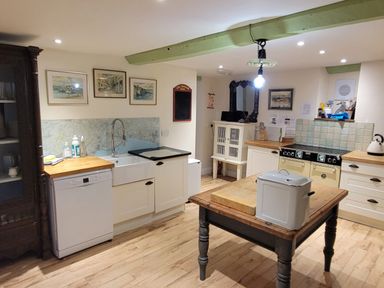 A kitchen with a sink and stove at Old Monmouth in Lyme Regis