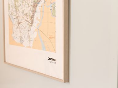A framed map on a wall labeled Cartmel Lake District at Low Longlands in Cartmel