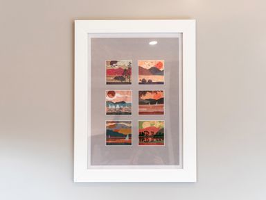 A framed artwork with six small landscape pictures labeled Derwentwater Wastwater Ullswater Coniston Water Windermere and Buttermere at Middle Longlands in Cartmel