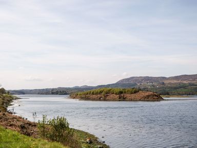 A river with an island and hills in the background at Bridgetown Cottage in Kerrykeel County Donegal