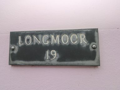 A nameplate with the text Longmoor 19