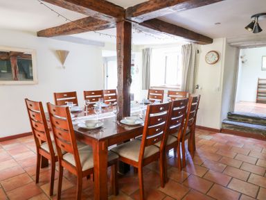 A dining room with a wooden table and chairs at Penarth near Cregrina Builth Wells