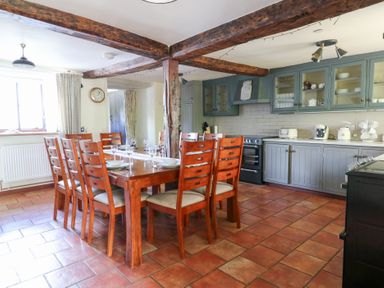 A kitchen with a dining table and chairs at Penarth in Cregrina near Builth Wells