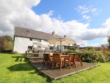 A garden with outdoor furniture at Penarth in Cregrina near Builth Wells
