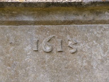 Stone surface with the year 1613 carved into it