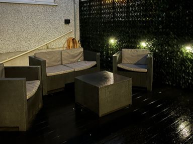 Seating arrangement with table in a garden at Y Berth in Llanberis