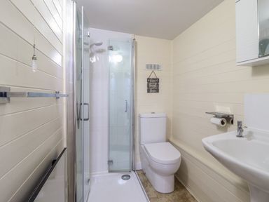 A bathroom with a shower cubicle toilet and sink at Tyn Y Cefn Near Blaenau Ffestiniog