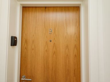 A wooden door with the number 9 and a silver handle at Above & Beyond in Whitby