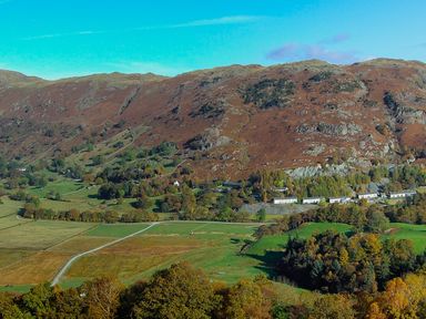 A rural landscape with hills trees fields and houses at Fellside View in Chapel Stile
