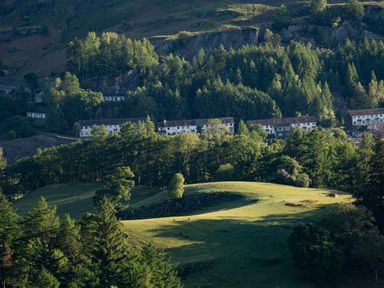Hillside with trees and white houses in a valley at Fellside View in Chapel Stile