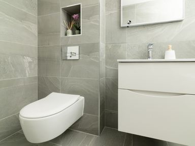 A bathroom with a toilet and sink at Sandy Cove in Praa Sands