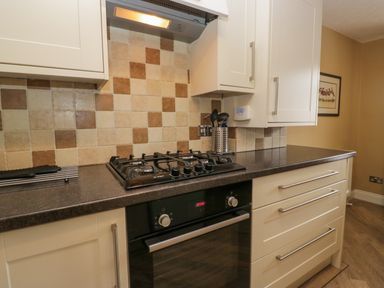 A kitchen with gas hob and oven at Jenny's in Hawkshead