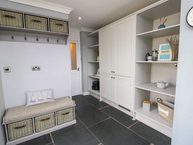 A mudroom with storage bench and shelves at Valley Pines in Valley