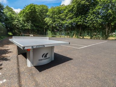 An outdoor sports area with a table tennis table at Lilyvale Davidstow near Camelford