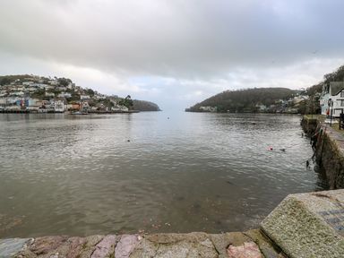 A waterfront with houses on hills on both sides of a river at Green Retreat in Dartmouth