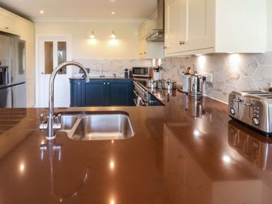 A kitchen with a sink and appliances at Seadrift in Dunwich Near Westleton