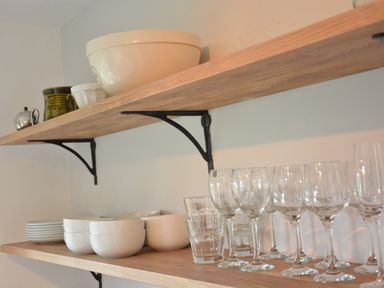 Wooden kitchen shelves with bowls plates and glasses at Rookyards Spexhall Near Halesworth