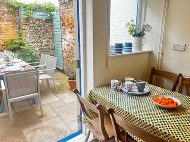 A dining room with a table and chairs at Seaflower, Aldeburgh
