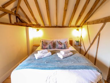 A bedroom with a bed and pillows at Fishpond House, Sotherton